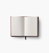 A mini hardcover journal, embroidered with delicate Gracie blooms and gold accents. Inside, find 240 blank, unlined pages and a ribbon bookmark.