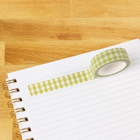 Green Gingham Washi Tape

Our washi tape is made for paper lovers, pen pals, and anyone who gets butterflies in the stationery aisle. Perfect for journaling, scrapbooking, decorating envelopes, or adding a personal touch to planners and calendars. It's gentle on paper, easy to tear by hand, and removable without leaving residue, so you can rearrange, redo, and re-stick as needed.

Design Features:&nbsp;

Each roll measures 15mm wide on a 10m roll
Full color repeating pattern
Washi tape dispenser packaging
P