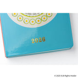 The back of the cover depicts a smiling sun that had been on the back cover of the original book. The design around the sun simultaneously looks like warm rays of light and a daisy like the ones blooming around the little house.