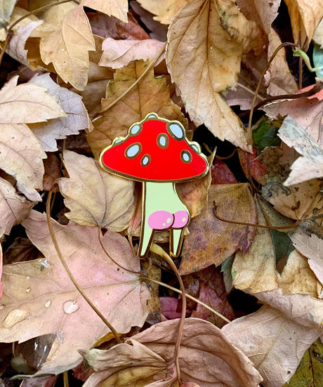 Booty Mush enamel Pin measures 2.6 x 3.5cm, made from red, cream and white hard enamel with shiny gold metal finish and pink screen-printed rosy bum cheek details.

This pin is held in place with secure rubber backing. Comes on a 100% post-consumer recycled backing card.

Designed in Melbourne by Hannakin.
