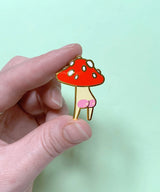 Booty Mush enamel Pin measures 2.6 x 3.5cm, made from red, cream and white hard enamel with shiny gold metal finish and pink screen-printed rosy bum cheek details.

This pin is held in place with secure rubber backing. Comes on a 100% post-consumer recycled backing card.

Designed in Melbourne by Hannakin.