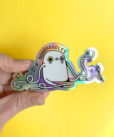"Noodles" Vinyl Sticker made from Hannakin illustration with holographic accents (background) and shiny gloss finish.

Made from a durable waterproof vinyl with a matte laminate that protects it from scratching, rain and sunlight.