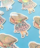 "Pearl" Vinyl Sticker made from Hannakin illustration with subtle holographic accents (on the face and oyster shell) with shiny gloss finish.

Made from a durable waterproof vinyl with a matte laminate that protects it from scratching, rain and sunlight.