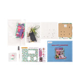 Step into the charming world of Hello Kitty with this delightful miniature house kit, where she runs her very own bookstore. Filled with tiny books, adorable gifts, and colorful gift bags, this kit is decorated in Hello Kitty's iconic style. The charming "open" sign welcomes you into the cozy shop, where a little lamp lights up the interior, creating a warm and inviting atmosphere. Perfect for fans and crafters alike, this kit offers hours of fun and a beautiful keepsake to treasure.