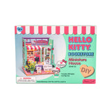 Step into the charming world of Hello Kitty with this delightful miniature house kit, where she runs her very own bookstore. Filled with tiny books, adorable gifts, and colorful gift bags, this kit is decorated in Hello Kitty's iconic style. The charming "open" sign welcomes you into the cozy shop, where a little lamp lights up the interior, creating a warm and inviting atmosphere. Perfect for fans and crafters alike, this kit offers hours of fun and a beautiful keepsake to treasure.