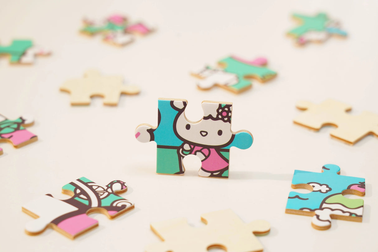Discover joy with the Hello Kitty Wooden Jigsaw Puzzle: Amusement Park (96pcs). This officially licensed Sanrio product features iconic Hello Kitty in 96 vibrant wooden pieces. Crafted for durability and a seamless fit, it's a delightful challenge for fans of all ages 8+. Embrace positivity and bring Hello Kitty to life with this charming puzzle – perfect for relaxation and family fun. Display your completed masterpiece proudly and celebrate the timeless appeal of Hello Kitty.
