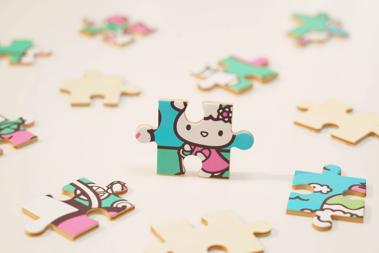 Discover joy with the Hello Kitty Wooden Jigsaw Puzzle: Amusement Park (96pcs). This officially licensed Sanrio product features iconic Hello Kitty in 96 vibrant wooden pieces. Crafted for durability and a seamless fit, it's a delightful challenge for fans of all ages 8+. Embrace positivity and bring Hello Kitty to life with this charming puzzle – perfect for relaxation and family fun. Display your completed masterpiece proudly and celebrate the timeless appeal of Hello Kitty.