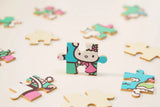 Discover joy with the Hello Kitty Wooden Jigsaw Puzzle: Amusement Park (96pcs). This officially licensed Sanrio product features iconic Hello Kitty in 96 vibrant wooden pieces. Crafted for durability and a seamless fit, it's a delightful challenge for fans of all ages 8+. Embrace positivity and bring Hello Kitty to life with this charming puzzle – perfect for relaxation and family fun. Display your completed masterpiece proudly and celebrate the timeless appeal of Hello Kitty.