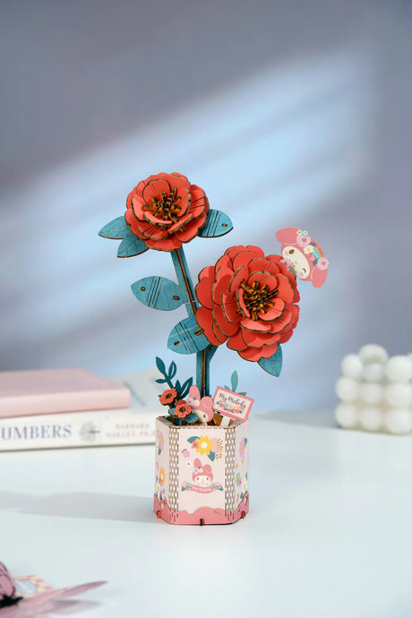 This 3D Wooden Puzzle Kit from Hands Craft lets your creativity bloom as you build a beautiful red camellia flower featuring the beloved My Melody character from Hello Kitty and Friends. Made from high-quality natural wood, the pieces fit together precisely, offering a fun and rewarding challenge for both adults and kids.