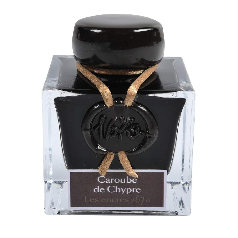 The 1670 Anniversary Collection celebrates the life of the 17th-century French adventurer, Jacques Herbin. Sailing from India, Monsieur Herbin arrived home to Paris with formulas for the now-famous Herbin inks and sealing waxes.

Enhanced with a luxurious, golden metallic sheen, these highly saturated inks will add an elegant luster to all your writing.&nbsp;

The intense brown of Caroube ink is streaked with fire-coloured reflections (gold flakes) to give a sparkle to the various writings.

Hand bottled wi