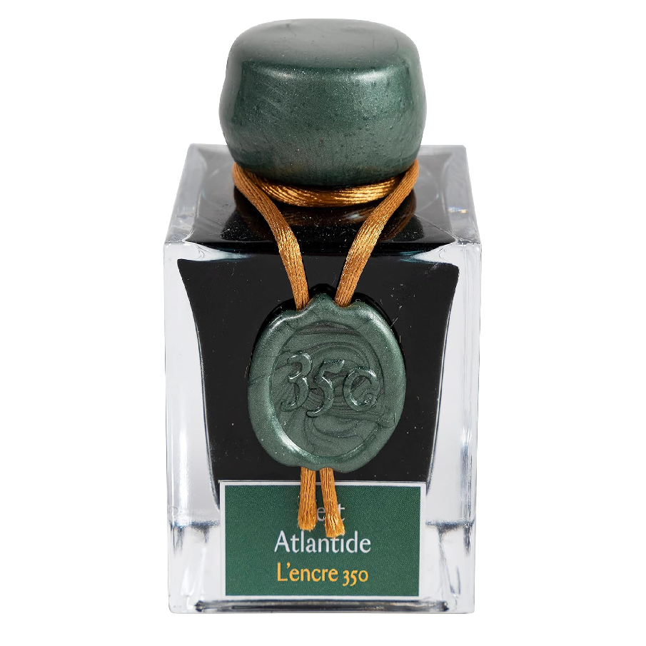 Ink 350, from the exclusive Jacques Herbin Prestige Collection, celebrates the launch date of the Jacques Herbin house in Paris in 1670. Vert Atlantide ink, a dark, intense colour, is illuminated with silver and gold flakes.

This ink is a tribute to the navigator Jacques Herbin, whose legend tells of his interest in lost places such as Antlantide.&nbsp;

Hand bottled with wax-dipped cap and seal.
50ml bottle.
Made in Paris.