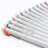 The Hobonichi Techo uses 12 soft colors across the book. The TSUKI no IRO stationery series incorporates these colors into simple designs.

This set of six Uniball One pens features vibrant, bold ink colors selected in colors that go well with the printing colors used for each of the twelve months in the Hobonichi Techo.
The twelve colors are divided into two sets of six pens—one for January through June, and the other for July through December—each housed in an original case.