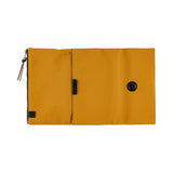 Its standout feature is the generously sized pocket, but its overall appearance remains clean and minimal. The vibrant yet subdued mustard color gives it a beautiful finish that suits anyone, regardless of style. Though it folds into thirds and fastens with a magnetic closure, the cover is light in hand. The aim was effortless elegance, something that looks sharp without being flashy. The material is a soft nylon with a sophisticated sheen.
