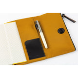 Inside, you’ll find ample storage: a leather pocket on the right side and five card pockets on the left. The pen hook is designed to hold your pen by its clip.
