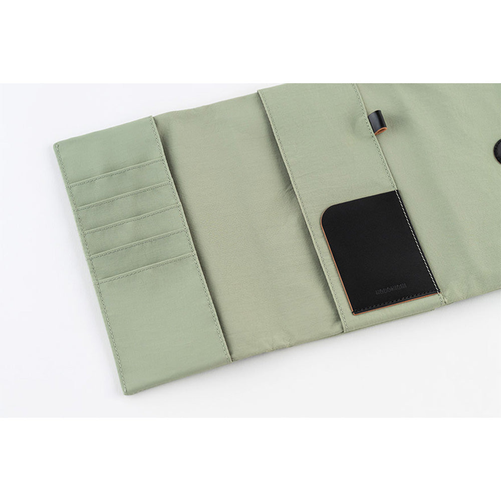 Inside, you’ll find ample storage: a leather pocket on the right side and five card pockets on the left. The pen hook is designed to hold your pen by its clip.
