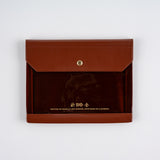 Hobonichi Alettone: Document Case for A6 Size Brown leather envelope with gold accents on a white background
