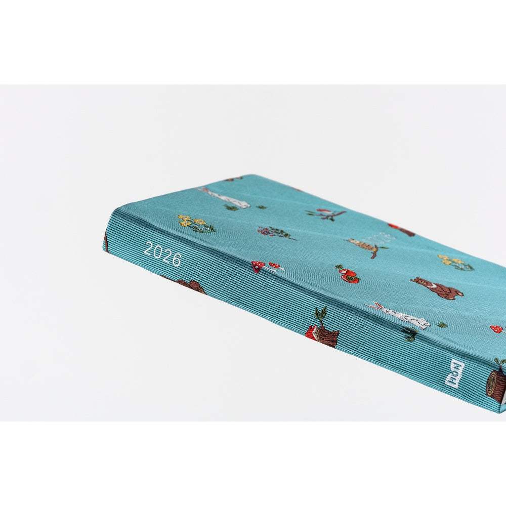 The book spine is foil-pressed in silver with the year 2026 and the HON logo for easy reference when placed in your bookshelf alongside other books.