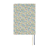 Sasha Kiora is a small floral pattern reminiscent of the pastoral illustrations by Kate Greenaway, a representative picture book artist of the latter half of 19th century Britain. With pink and light blue anemones drifting through the breeze, and small buds and leaves peeking through, this elegant design is reminiscent of a windy meadow.