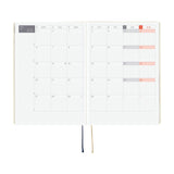 Hobonichi HON 2026 Slash (Ivory) [ENG/A5/Jan Start] HON Double-page spread of a calendar with marked dates on a white background