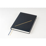 Hobonichi HON 2026 Slash (Navy) [ENG/A5/Jan Start] HON Black notebook with a gold accent on a white background