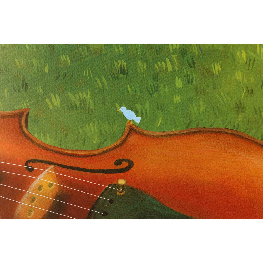 Close-up of a violin with a grassy background