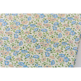 Hobonichi Liberty Fabrics: Sasha Kiora ENG / A5 / Jan Start HON Floral patterned fabric with blue, orange, and green flowers on a white background