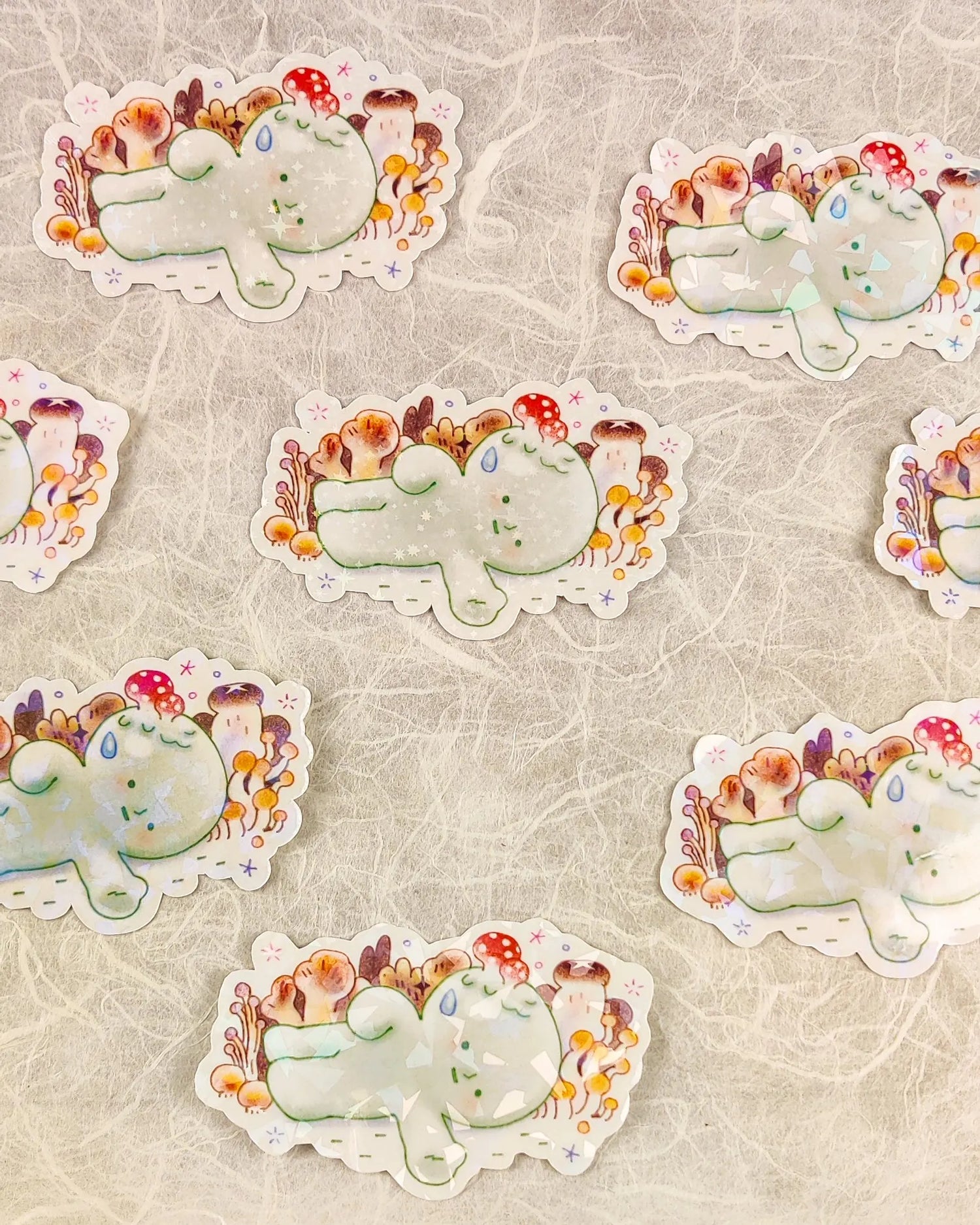This is a glossy vinyl die-cut paper sticker with holographic features, illustrated and made in-house by me. It's waterproof and ideal for decorating hard surfaces like laptops, water bottles, and phone cases, adding a cute touch to your belongings.&nbsp;

Material: premium glossy waterproof vinyl