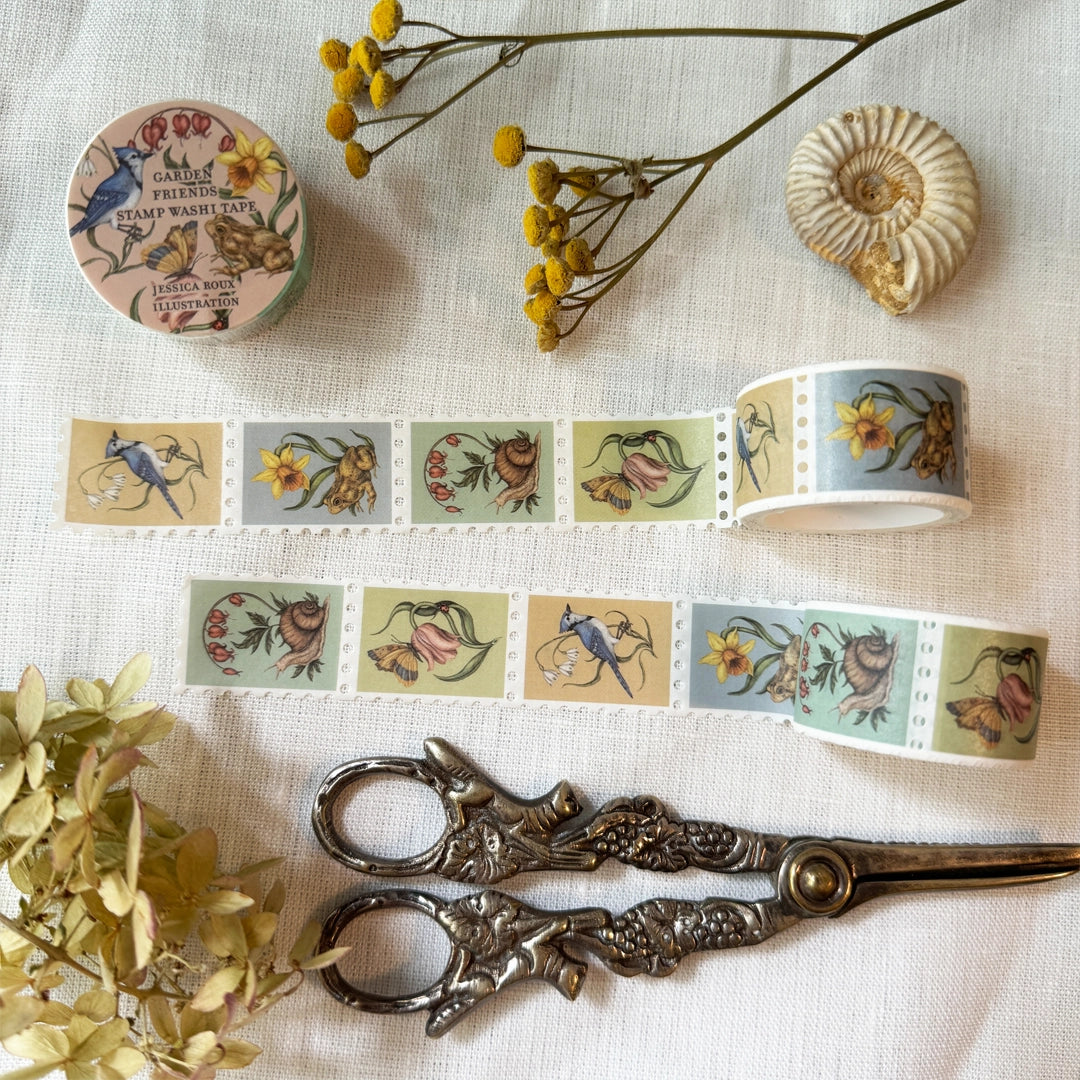 Washi tape featuring garden friends, including a blue jay with a snowflake flower, a toad with a daffodil, a moth and ladybug with a tulip, and a snail with a bleeding heart plant. Illustrated by Jessica Roux.

Each tape is 25mm wide. Individual stamps feature perforation for tearing or cutting. Matte finish perfect for scrapbooking, bullet journaling, and more.

Please note, these are decorative and have no postage value.

Each tape is shrink wrapped and has a sticker label.
