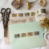 Washi tape featuring garden friends, including a blue jay with a snowflake flower, a toad with a daffodil, a moth and ladybug with a tulip, and a snail with a bleeding heart plant. Illustrated by Jessica Roux.

Each tape is 25mm wide. Individual stamps feature perforation for tearing or cutting. Matte finish perfect for scrapbooking, bullet journaling, and more.

Please note, these are decorative and have no postage value.

Each tape is shrink wrapped and has a sticker label.