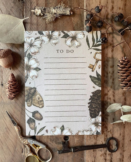 Whimsical, nature-inspired notepads perfect for writing your to do list, grocery list, and more. 50 pages, with full color illustration on the front of every page.

Matte finish perfect for writing.

Packaged in a clear cello sleeve.

Dimensions: 5.5"x4"
