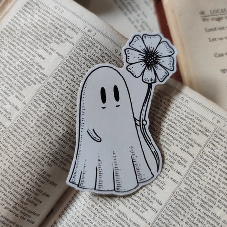 Die-cut vinyl sticker featuring an adorable ghostie pal with a flower for you! Design from an original Jon Turner ink drawing.