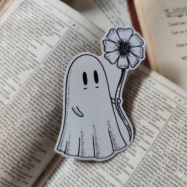 Die-cut vinyl sticker featuring an adorable ghostie pal with a flower for you! Design from an original Jon Turner ink drawing.
