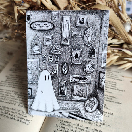 A little ghost and their gallery of art, printed on a sticker to add some spooky charm to your laptop, water bottle, or any other surface. From my original pen and ink artwork.