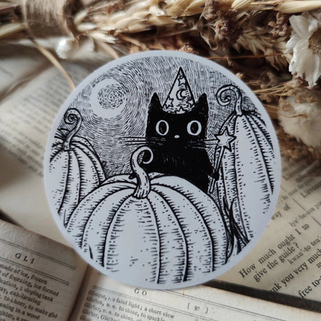 Simon's in the pumpkin patch again! A little magical black cat on a lovely die-cut vinyl sticker, from original pen and ink artwork by Jon Turner.
