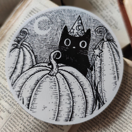Simon's in the pumpkin patch again! A little magical black cat on a lovely die-cut vinyl sticker, from original pen and ink artwork by Jon Turner.