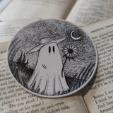 A little Van Gogh-inspired ghostie holding a sunflower beneath a starry night sky, from an original ink drawing by Jon Turner.