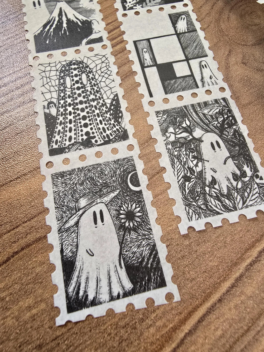 One of two tapes from the Creative Spirits series by Jon Turner, little ghosties taking you on an eclectic tour of art history. This roll features ghosts inspired by Vincent Van Gogh, Frida Kahlo, Piet Mondrian, Claude Monet, Henri Matisse, Hokusai, Malika Favre, Gustav Klimt, Keith Haring, and Yayoi Kusama.

Perforated to look like a roll of postage stamps, this washi tape features a repeating pattern of ten designs in portrait format from hand-drawn pen and ink artwork, recreated in incredible detail at m