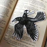 A sticker featuring a little spirit soaring high on the back of a crow, from original pen and ink artwork by Jon Turner.

Die-cut vinyl sticker, suitable for interior or exterior use. Measures approximately 9.5cm (3.75 inches) diameter. Supplied unpackaged