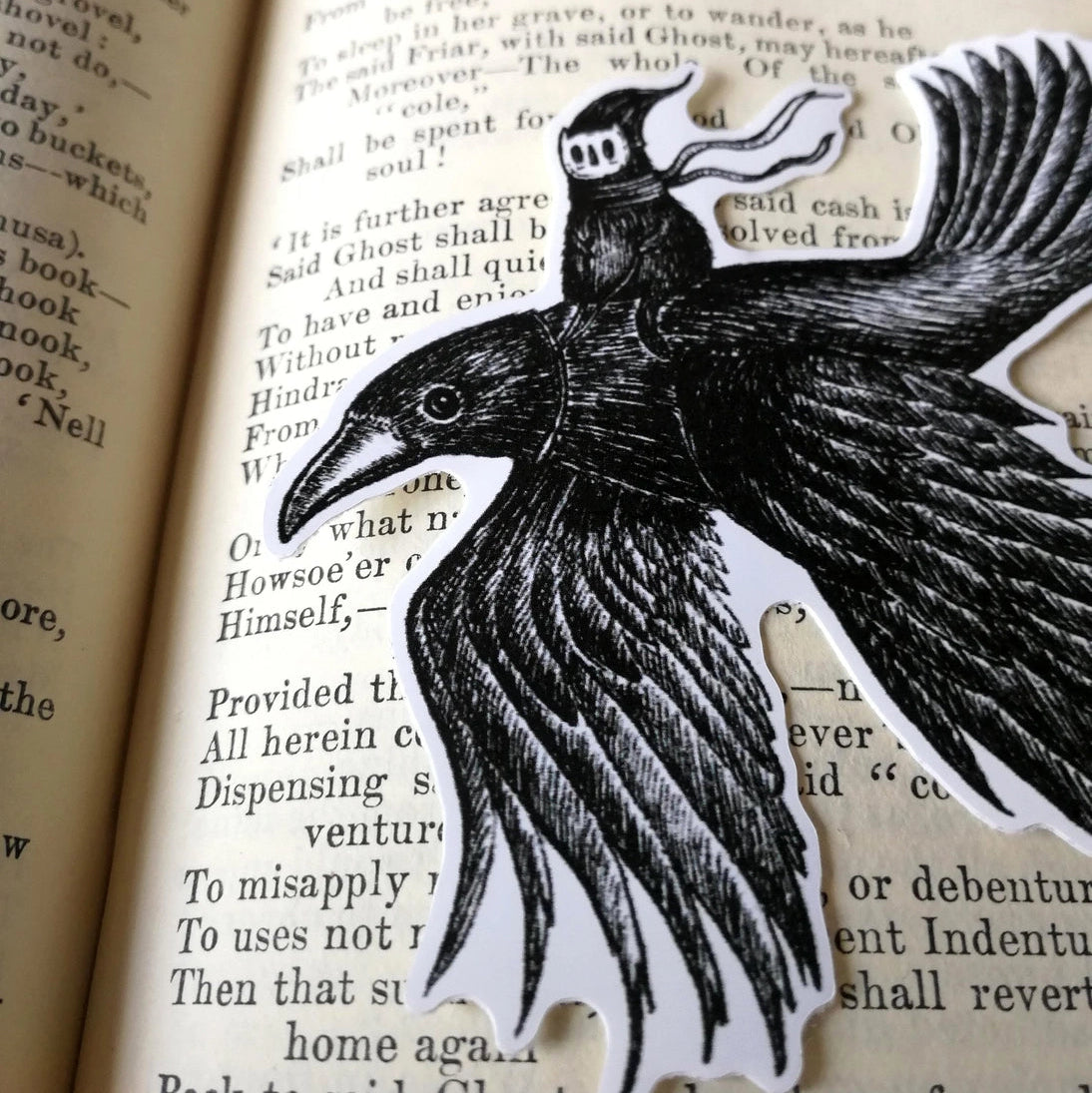 A sticker featuring a little spirit soaring high on the back of a crow, from original pen and ink artwork by Jon Turner.

Die-cut vinyl sticker, suitable for interior or exterior use. Measures approximately 9.5cm (3.75 inches) diameter. Supplied unpackaged
