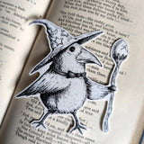 Sticker featuring a wizard bird with a magical egg staff, from my original pen and ink artwork.

Die-cut vinyl sticker, suitable for interior or exterior use. A sticker featuring a little spirit soaring high on the back of a crow, from original pen and ink artwork by Jon Turner.