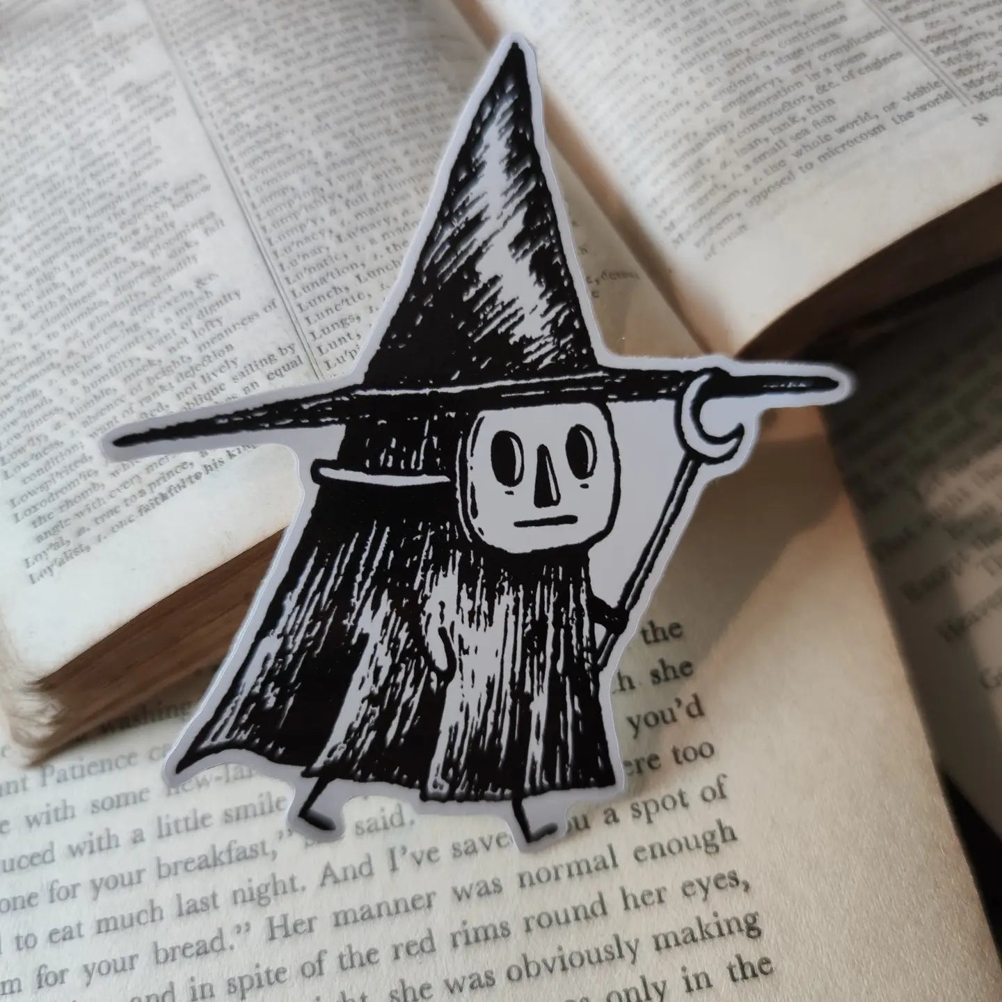 Sticker featuring a tiny witch spirit, from my original pen and ink artwork.

Die-cut vinyl sticker, suitable for interior or exterior use. Available as a single sticker or a set of five matching stickers to share with friends. Measures approximately 8.5cm (3.3 inches) at its tallest point.
