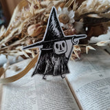 Sticker featuring a tiny witch spirit, from my original pen and ink artwork.

Die-cut vinyl sticker, suitable for interior or exterior use. Available as a single sticker or a set of five matching stickers to share with friends. Measures approximately 8.5cm (3.3 inches) at its tallest point.