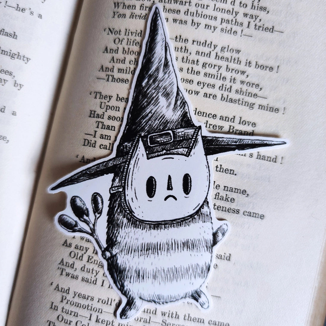Sticker featuring a tiny wizard spirit in a big hat, from my original pen and ink artwork.

Die-cut vinyl sticker, suitable for interior or exterior use. Available as a single sticker or a set of five matching stickers to share with friends. Measures approximately 8.5cm (3.3 inches) at its tallest point.&nbsp;