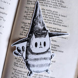Sticker featuring a tiny wizard spirit in a big hat, from my original pen and ink artwork.

Die-cut vinyl sticker, suitable for interior or exterior use. Available as a single sticker or a set of five matching stickers to share with friends. Measures approximately 8.5cm (3.3 inches) at its tallest point.&nbsp;