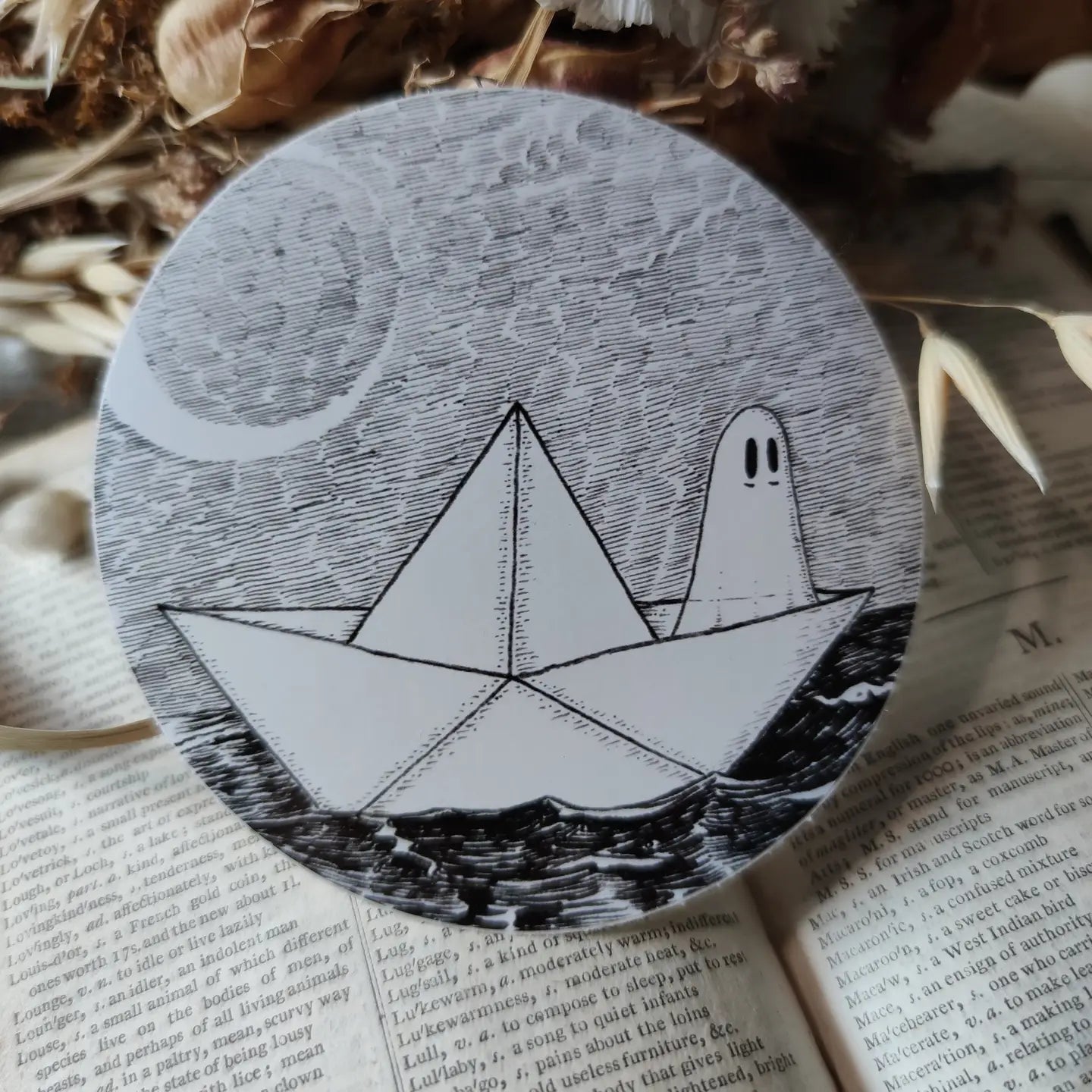 A little ghostie on the high seas, printed on a sticker to add some spooky charm to your laptop, water bottle, or any other surface. From my original pen and ink artwork.

Die-cut vinyl sticker, suitable for interior or exterior use. Measures approximately 76mm (3 inches) across.