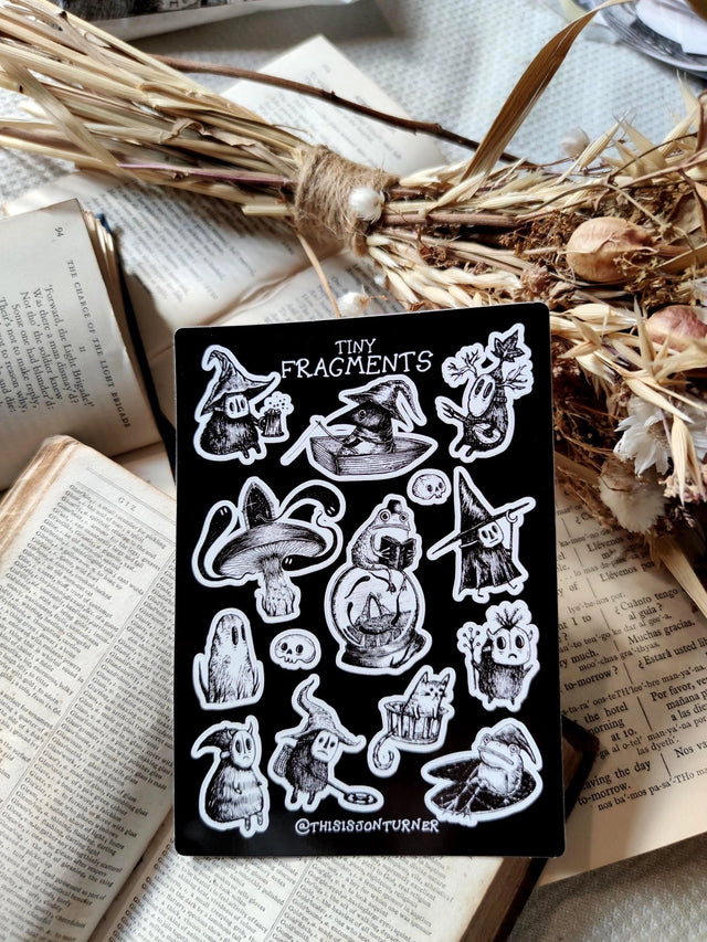 Fourteen tiny spooky sticker pals, from my book Fragmnets, to decorate your laptop, phone, lunchbox, notebook or any other surface you feel needs a bit of fantasy flair.

On an A6 (105x148mm) sized vinyl sheet, each sticker is kiss cut for easy peeling.&nbsp;