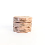 This narrow washi tape features a charming design of swift rabbits and dianthus flowers
