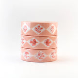 This delightful washi tape features a design of diamonds inset with different flowers and charming flying birds with bows