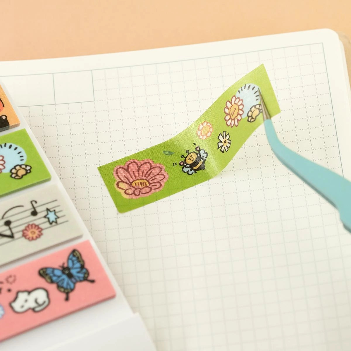 A delightful collaboration between King Jim and RiN! Studio, bringing original artwork to the iconic Kitta format. Pre-cut into individual strips and packed in a slim, pocket-sized booklet - no scissors, no mess, just peel and stick anywhere.&nbsp;

&nbsp;Perfect for journaling, planners, snail mail, and creative moments on the go.&nbsp;

&nbsp;Tiny format. Big charm. Pure Kitta convenience.&nbsp;


Materials: Washi Tape on release paper