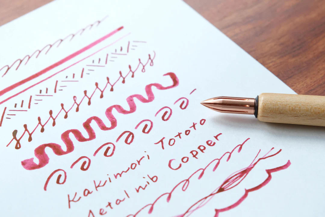 The copper nib was born from a desire for a durable and practical dip pen nib. Enjoy a variety of line widths from fine to broad by tilting the nib at different angles. Fits most nib holders as well as those from our range.

The nib was designed by Yuto Yamazaki of Kuramae-based design studio Alloy. The nib tip has been rounded and polished with meticulous care, providing a remarkably smooth writing experience that defies expectation. Perfected over many iterations, the innovative nib is like no other.

Abo